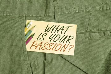 Writing note showing What Is Your Passion Question. Business concept for asking about his strong and barely controllable emotion Writing equipment and yellow note paper inside pocket of man trousers