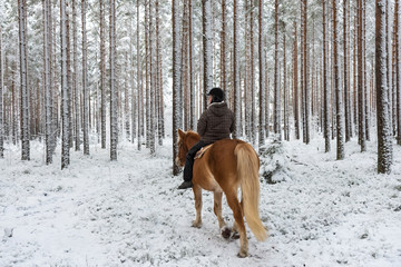 Woman horseback riding
