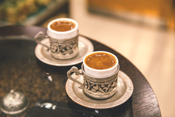 Two cupd of coffee.