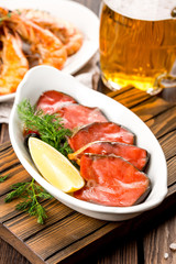 Beer with appetizers red fish and shrimp