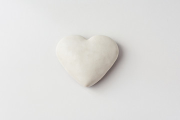 Gingerbread glazed in the form of hearts on a white background.