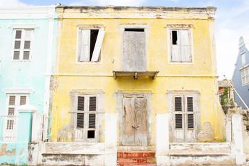 Yellow dilapidated house in Willemstad, Curacao
