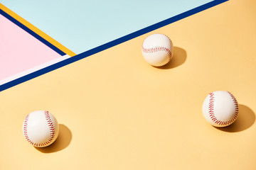 White baseball balls on surface with blue lines