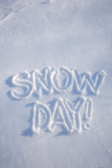 Snow Day! message handwritten in fresh white winter powder