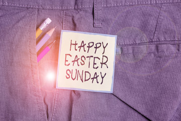 Text sign showing Happy Easter Sunday. Business photo showcasing Greeting someone about holidays Spring is coming Writing equipment and green note paper inside pocket of man work trousers