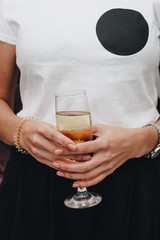 Woman holding glass with champagne