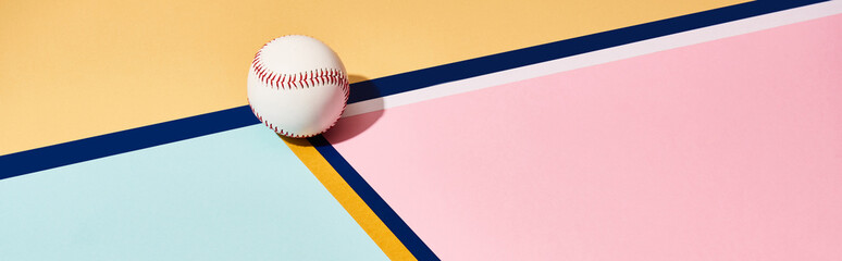 Baseball with shadow on colorful background with lines, panoramic shot