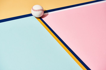 Baseball with shadow on colorful background with lines
