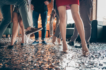 Cropped close-up photo of slim legs girls guys meeting rejoicing dance floor x-mas party glitter...