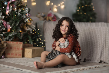 portrait of a little girl in studio decorated for christmas