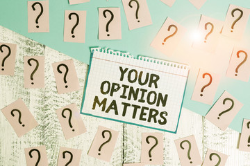 Writing note showing Your Opinion Matters. Business concept for to Have your say Providing a Valuable Input to Improve Scribbled and crumbling papers with thick cardboard above wooden table