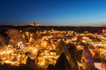 Beautiful aeral night view Goreme, Cappadocia, Turkey. Famous center of balloon fligths