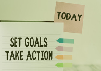 Word writing text Set Goals Take Action. Business photo showcasing Act on a specific and clearly laid out plans Hard cover note book sticky note arrow banners inserted clear background