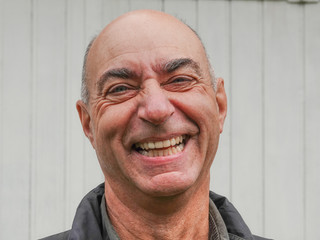 Obraz premium Handsome mature happy bald man smiling at the camera