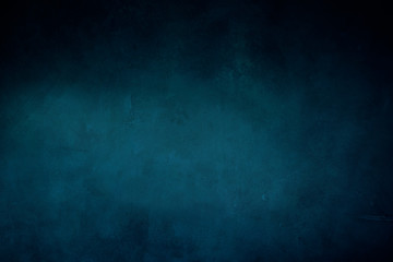 dark blue grungy background or texture with pastel hues