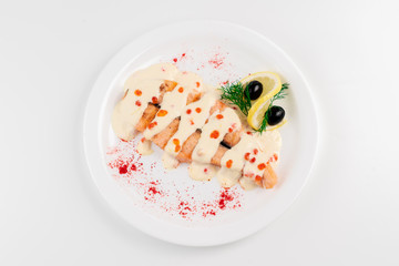 salmon steak with caviar on a white background