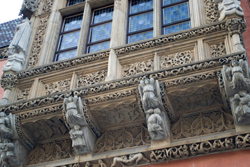 Fototapeta premium Decoration details of the city hall in Wroclaw, Poland. Part of the city hall building in the central square. Medieval architecture and a mix of Renaissance and Gothic styles in Poland.