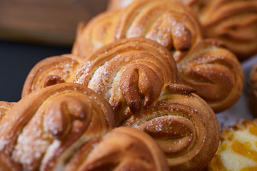 Fresh buns in bakery shop
