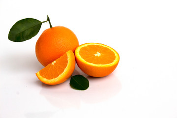 oranges with leaves isolated on white background