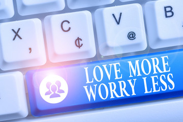 Word writing text Love More Worry Less. Business photo showcasing Have a good attitude motivation be lovable enjoy life White pc keyboard with empty note paper above white background key copy space