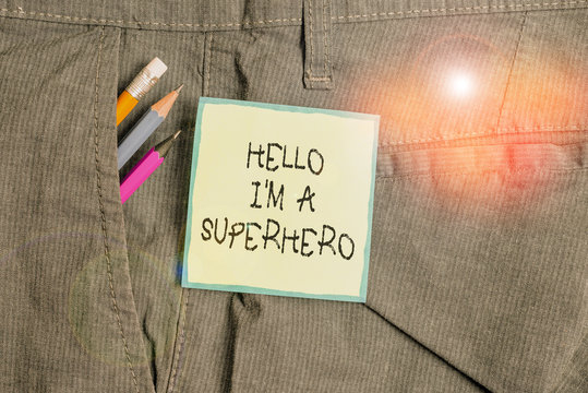 Text sign showing Hello I M A Superhero. Business photo showcasing Believing in yourself Selfconfidence Introduction Writing equipment and green note paper inside pocket of man work trousers