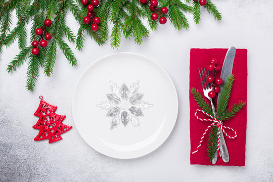 Christmas table setting with gifts and fir tree branch on stone background. Top view. Copy space - Image