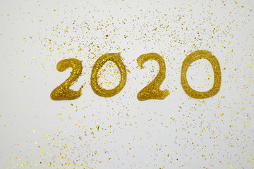 text of 2020 write by glitter pen on white paper