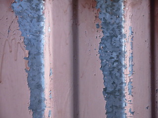 brown paint peels off the metal