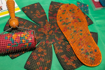 There is a needle applicator in the form of a rug, in the form of a roller and as an insole for...