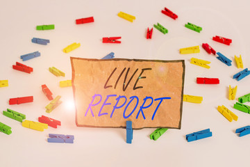 Handwriting text writing Live Report. Conceptual photo continuous stream of updates that are published in real time Colored clothespin papers empty reminder white floor background office