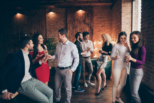 Photo of crowd of working people engaged in business having corporate party with fun and alcohol wearing formally talking with each other shaping communication