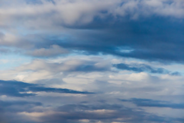 Beautiful thunderclouds. Fluffy volumetric clouds before a thunderstorm. Image without focus for design.