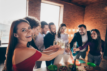 Portrait of nice attractive elegant cheerful cheery glad positive people celebrating birthday occasion clinking glass congrats greeting at modern industrial loft brick wood style interior lights house