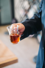 Hand holds a Cup of Turkish tea