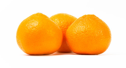 Ripe orange tangerines on a white background