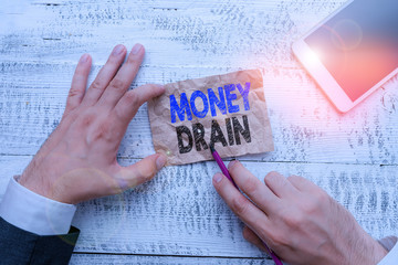 Conceptual hand writing showing Money Drain. Concept meaning To waste or squander money Spend money...