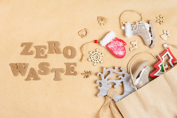 Eco friendly wooden toys for Christmas or New Year decoration on background of craft paper...