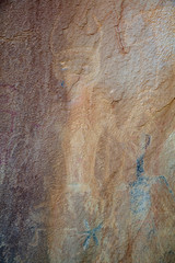 Detail of a part of the petroglyphs incised by the Fremont People in the sandstone rock face at Dinosaur National Monument, Utah