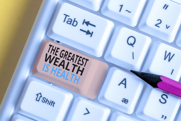 Text sign showing The Greatest Wealth Is Health. Business photo text Many sacrifice their money just to be healthy White pc keyboard with empty note paper above white background key copy space