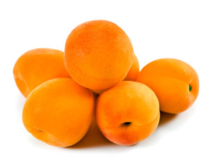 Heap of apricot fruits isolated on a white background