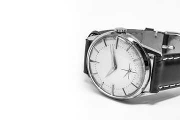 An old gold mechanical wristwatch with manual winding. Antique watch ruined by time, with scratches and mildew stains, rust, oxidation. Leather strap (band). Vintage clock. Spend time.