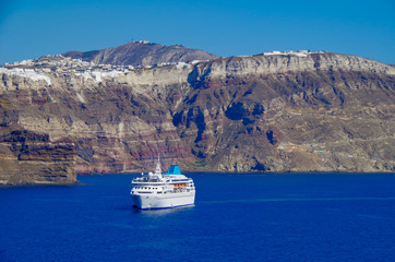 Luxury cruise ship liner during Mediterranean cruise in the Aegean Sea anchoring in the crater...