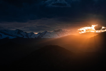 Sunlight leaking through clouds over the Rocky Mountains
