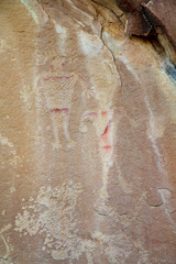 Detail of a part of the petroglyphs incised by the Fremont People in the sandstone rock face at Dinosaur National Monument, Utah