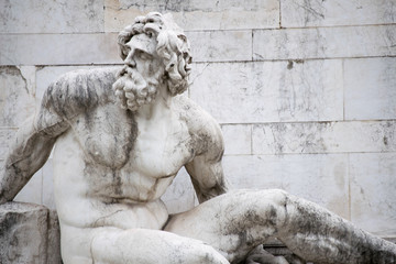  statue on a fountain in piazza venezia rome italy