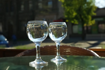 Two glasses of water at table in cafe, after coffee refreshing drink