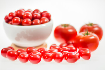 chery tomatoes on a white background with spices