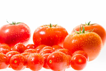 chery tomatoes on a white background with spices