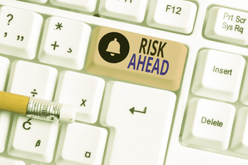 Writing note showing Risk Ahead. Business concept for A probability or threat of damage, injury,...