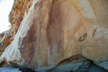Detail of a part of the petroglyphs incised by the Fremont People in the sandstone rock face at Dinosaur National Monument, Utah